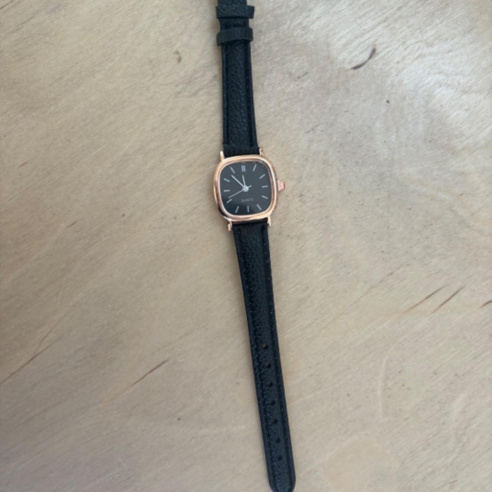 Women watch with black strap